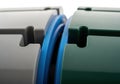Close-up of blue rubber seal in mechanical assembly with green and gray components Royalty Free Stock Photo