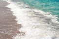 Close up blue sea water waves on sand beach Royalty Free Stock Photo