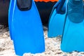 Close up blue snorkeling fins on the beach. Royalty Free Stock Photo