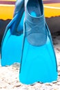 Close up blue snorkeling fins on the beach. Royalty Free Stock Photo