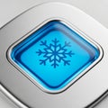 Close-up of a Blue Snowflake Icon on a Silver Square Button with Metallic Rim symbol Royalty Free Stock Photo