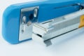 Close up blue stapler and staple