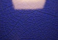 Close-up of a blue surface with a cracked texture resembling dried Royalty Free Stock Photo