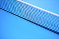 Net on a blue tennis table Royalty Free Stock Photo