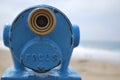 Close up blue telescope view point looking out to sea with copy space to the Royalty Free Stock Photo