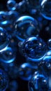 Close-up of blue transparent bubbles with reflective surfaces, abstract background. Science and technology concept Royalty Free Stock Photo