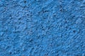 Close-up of blue wall with rough textured decorative plaster background. Royalty Free Stock Photo