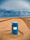 Close-up of a blue wastebasket on the beach of Gandia, Valencia, Royalty Free Stock Photo