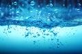 Close up blue Water splash with rain water drop falling down Royalty Free Stock Photo