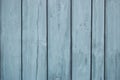 Close up of blue wooden fence panels.