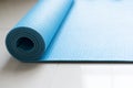 Close up of blue yoga mat on the floor in fitness class Royalty Free Stock Photo