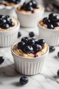 A close up of a blueberrytopped cupcake on a table Royalty Free Stock Photo