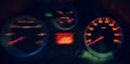 A Close up of the Blurred Illuminated Speedometer in Car