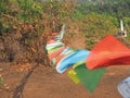 close up blurry multicolored Buddhist flags with mantras flutter Royalty Free Stock Photo