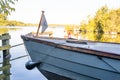 Small wooden boat moored on a lake in the countryside Royalty Free Stock Photo