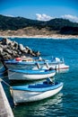 A close up of boats tied up to a dock in Black Sea. Letters on the boats says BS Burgas and Martin. Royalty Free Stock Photo