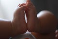 Close-up body parts baby infant chubby feet foot black isolated background cute baby boy toes innocent pure happy smile Royalty Free Stock Photo