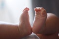 Close-up body parts baby infant chubby feet foot black isolated background cute baby boy toes innocent pure happy smile Royalty Free Stock Photo