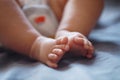 Close-up body parts baby infant chubby feet foot black isolated background cute baby boy toes innocent pure happy smile Royalty Free Stock Photo