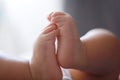 Close-up body parts baby infant chubby feet foot black isolated background cute baby boy toes innocent pure happy smile Royalty Free Stock Photo