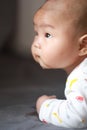 Close-up body parts baby infant chubby head dribble boy is suck eating his hands isolated background innocent pure happy smile Royalty Free Stock Photo