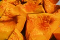 Close-up of boiled pumpkin pieces with honey. View from top. Old recipe for delicious and healthy food. Village treats.