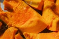 Close-up of boiled pumpkin pieces with honey. View from top. Old recipe for delicious and healthy food. Village treats.