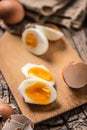 Close-up boiled or raw chicken eggs on wooden board Royalty Free Stock Photo