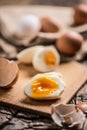 Close-up boiled or raw chicken eggs on wooden board Royalty Free Stock Photo