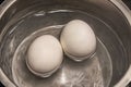 Close up boiling eggs in pot Royalty Free Stock Photo