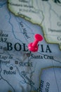 Close up of Bolivia pin pointed on the world map with a pink pushpin Royalty Free Stock Photo