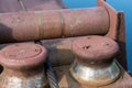 Close-up of bollards and iron cables on an old River barge. Old rusty vintage mooring bollard for boats, ships and yachts. Royalty Free Stock Photo