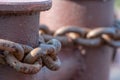 Close-up of bollards and iron chains on an old River barge. Securing the ship with a large chain. Old rusty vintage mooring Royalty Free Stock Photo