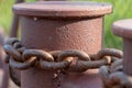 Close-up of bollards and iron chains on an old River barge. Securing the ship with a large chain. Old rusty vintage mooring Royalty Free Stock Photo