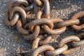 Close-up of bollards and iron chains on an old River barge. Securing the ship with a large chain. Old rusty vintage mooring Royalty Free Stock Photo