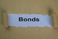 Close up Bonds Text written in torn paper