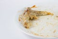 Close up of bone after eating steak on the white dish with with Royalty Free Stock Photo