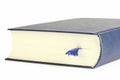 Close up of book with bookmark against white background