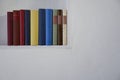 Close up of books in bookshelf in wall