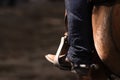 Close-up of Booted Foot in a Stirrup