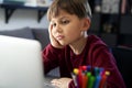 Close up of bored boy during homeschooling