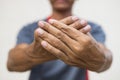 Close-up of both hands of a man numb to his nerve endings