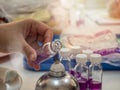 Close-up of bottle being sterilized with an alcohol burner before use in bacterial cultures. Medicine and microbiology concept