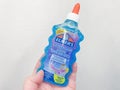 Moscow, Russia, December 2019: Close-up of a bottle of Elmer`s blue shiny glue for making slime