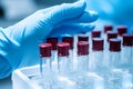 Close up of bottles with red lids in science laboratory. Research concept