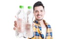 Close-up of bottles of water in young man hands Royalty Free Stock Photo