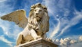 Statue of the Winged Lion of Saint Mark Against a Blue Sky with Clouds - Generative Ai Royalty Free Stock Photo