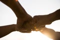 Close up bottom view of people giving fist bump showing unity and teamwork. Friendship happiness leisure partnership team concept Royalty Free Stock Photo