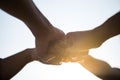 Close up bottom view of people giving fist bump showing unity and teamwork. Friendship happiness leisure partnership team concept Royalty Free Stock Photo