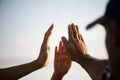 Close up bottom view of people giving hand showing unity and teamwork. Friendship happiness leisure partnership team concept Royalty Free Stock Photo